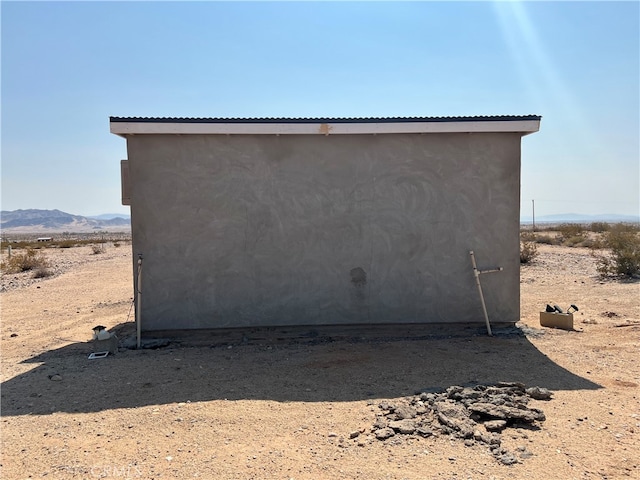 view of outbuilding featuring a mountain view