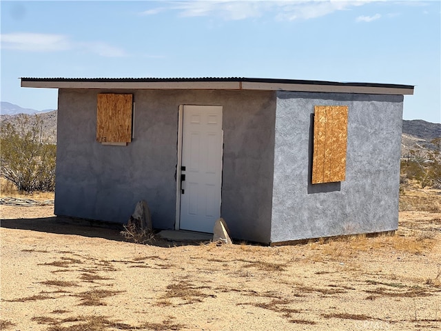 view of outbuilding with a mountain view