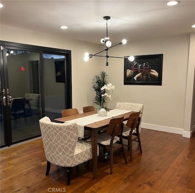 dining room with dark hardwood / wood-style flooring