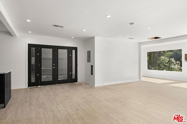 unfurnished living room with light wood-type flooring