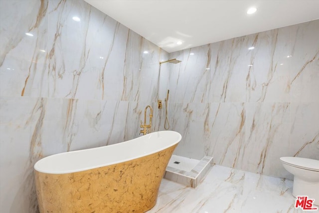 bathroom featuring toilet, plus walk in shower, and tile walls