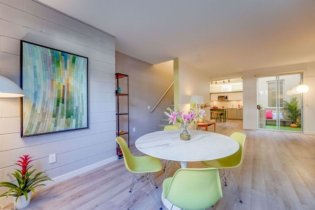 dining room with light hardwood / wood-style floors