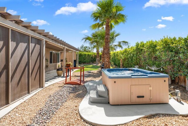 view of patio with a hot tub