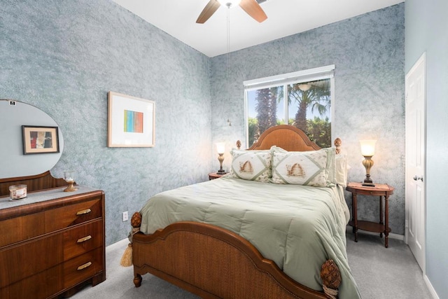 bedroom with ceiling fan and light colored carpet