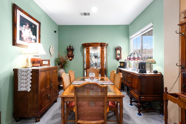 view of carpeted dining space