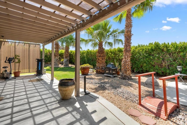 view of patio with a pergola and a grill