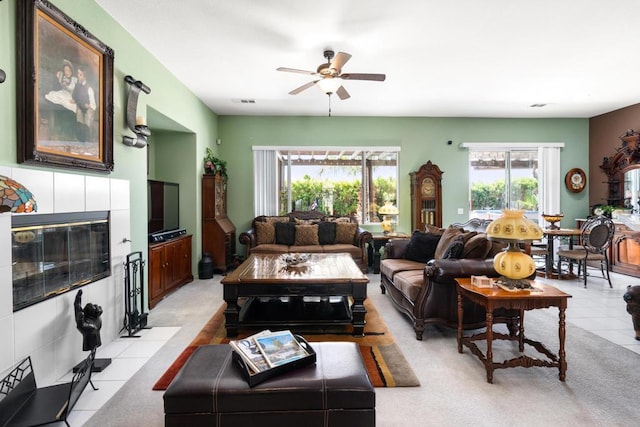 tiled living room featuring ceiling fan