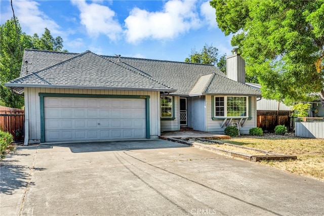 ranch-style home featuring a garage