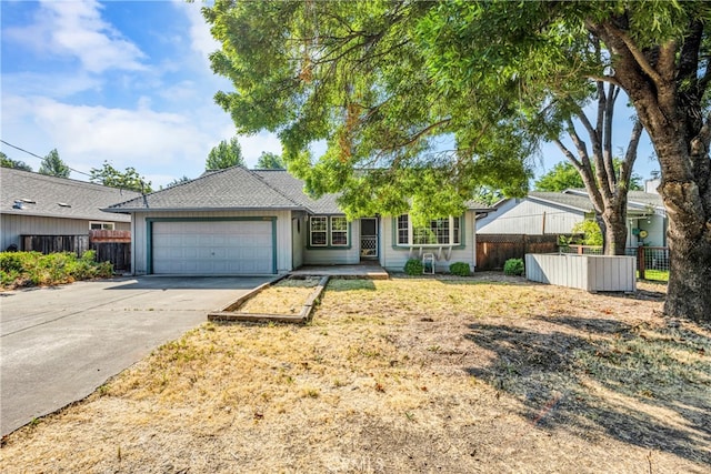 ranch-style house featuring a garage