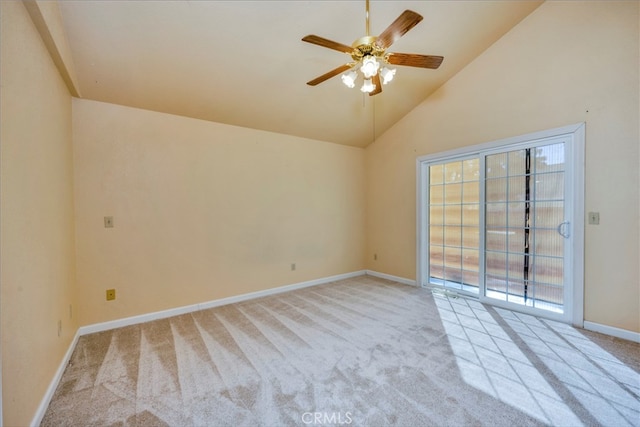 carpeted empty room with ceiling fan and high vaulted ceiling