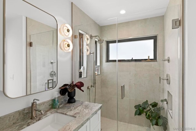 bathroom with vanity and walk in shower