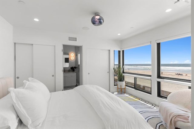 bedroom featuring a water view