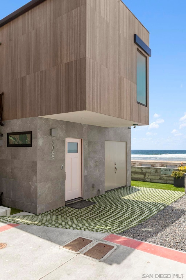 view of outbuilding with a water view