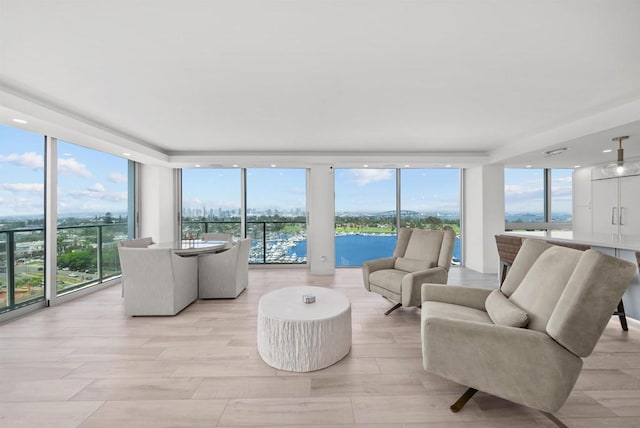 sunroom with a water view and plenty of natural light