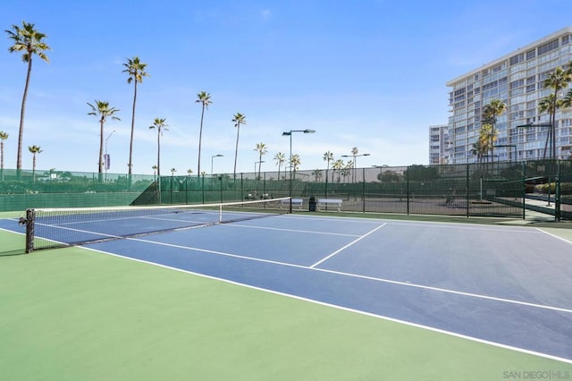 view of sport court with basketball hoop