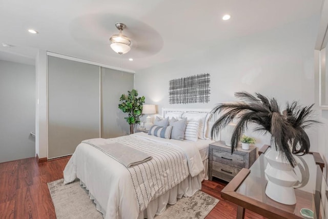 bedroom featuring dark hardwood / wood-style floors and ceiling fan