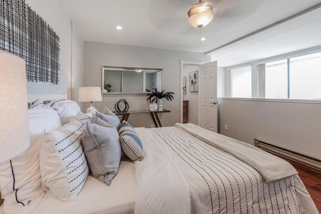 bedroom featuring hardwood / wood-style floors and ceiling fan