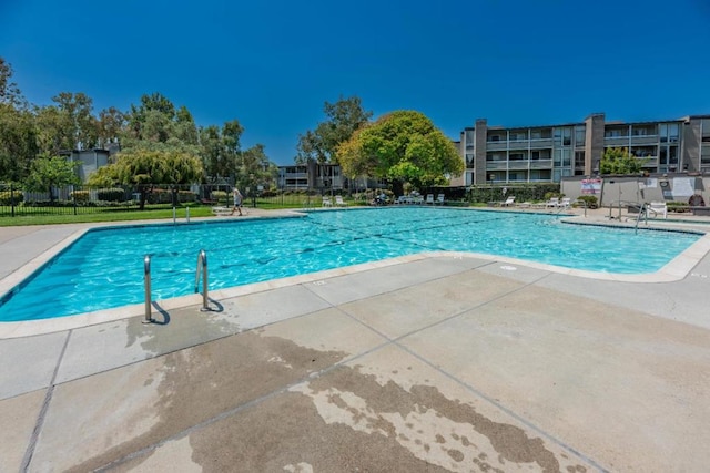 view of swimming pool with a patio