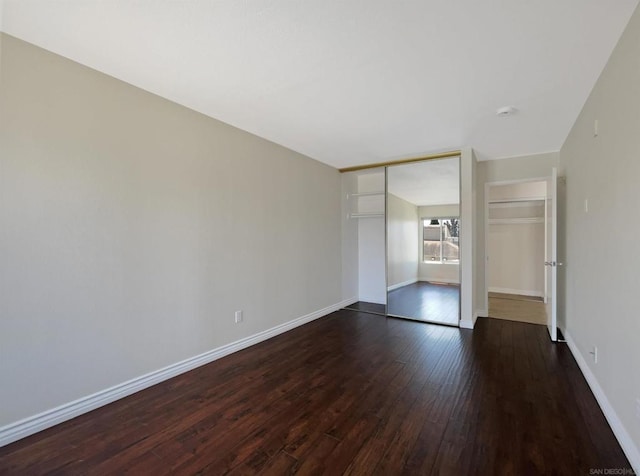 spare room with dark hardwood / wood-style flooring