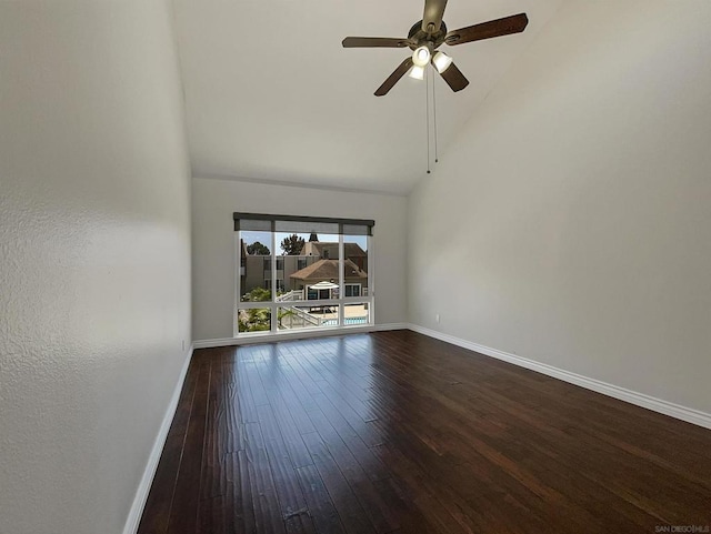 empty room featuring dark hardwood / wood-style flooring, high vaulted ceiling, and ceiling fan