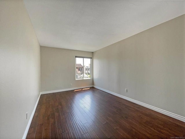 empty room featuring dark hardwood / wood-style floors