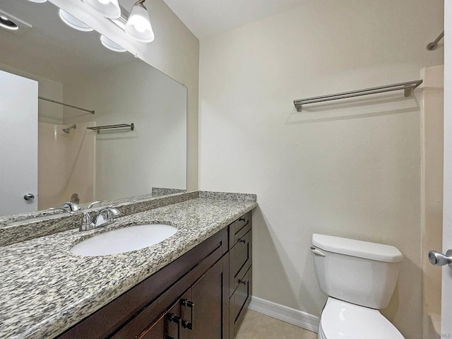 bathroom with a shower, vanity, and toilet