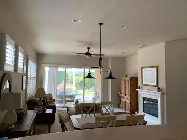 interior space with ceiling fan