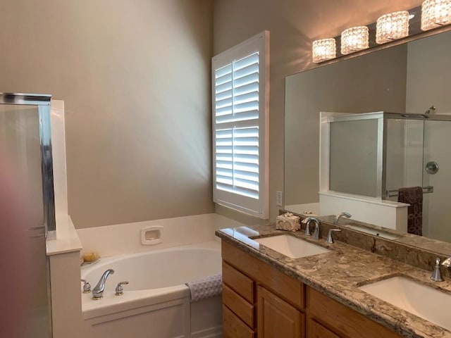 bathroom featuring vanity and shower with separate bathtub