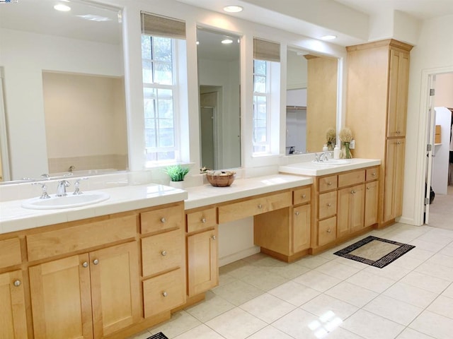 bathroom featuring tile patterned flooring and vanity