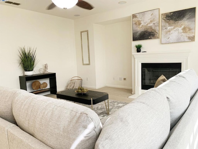 carpeted living room featuring ceiling fan