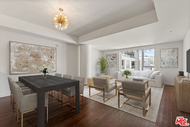 dining room with a chandelier and dark hardwood / wood-style flooring