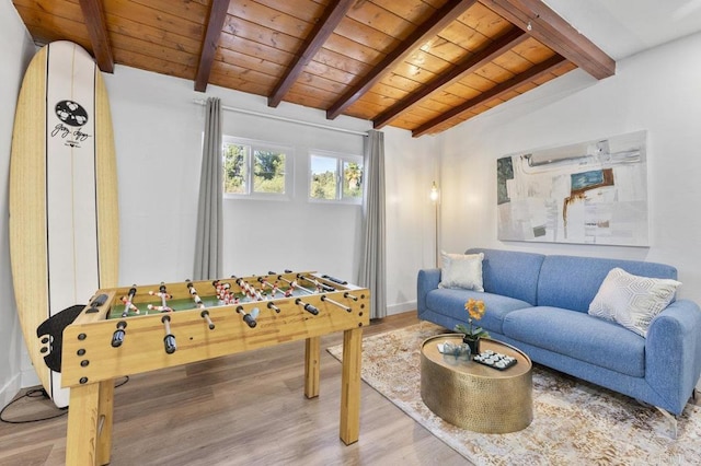 playroom featuring vaulted ceiling with beams, wood ceiling, baseboards, and wood finished floors