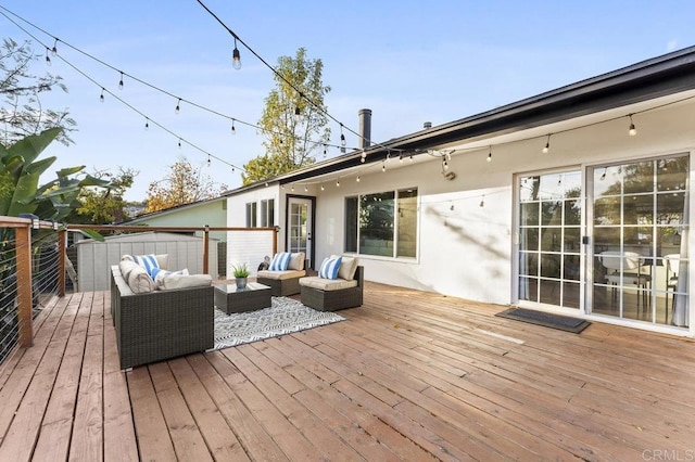 wooden deck featuring outdoor lounge area