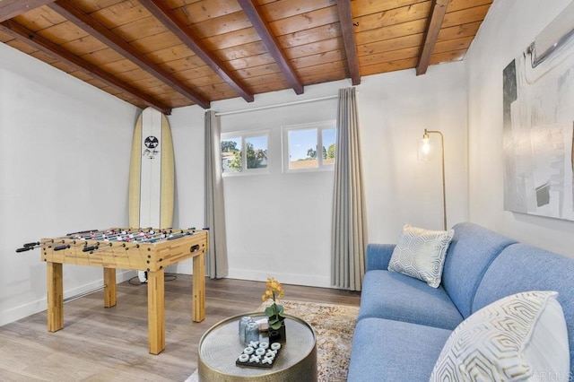 game room featuring lofted ceiling with beams, wood ceiling, light wood finished floors, and baseboards