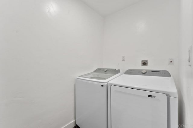 laundry area with laundry area and washer and clothes dryer