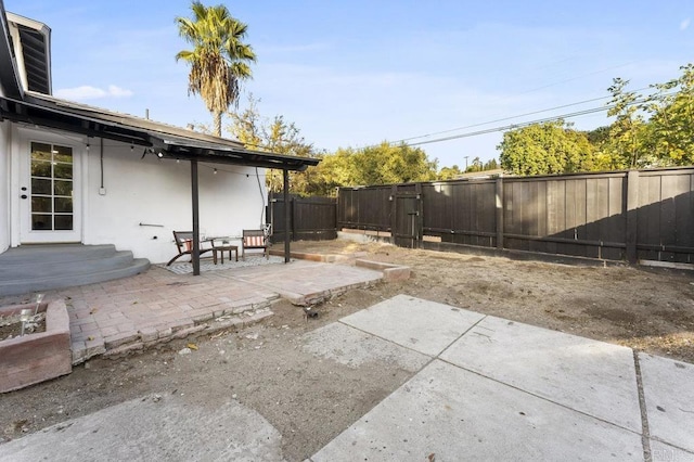 fenced backyard with a patio