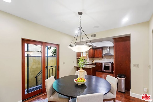 dining space featuring dark hardwood / wood-style floors