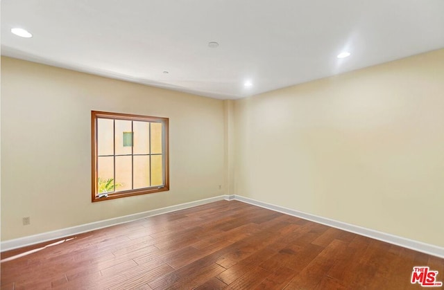 empty room with wood-type flooring