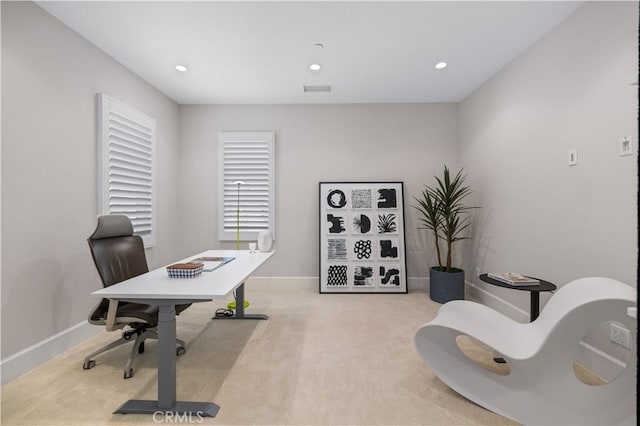 office area featuring light colored carpet