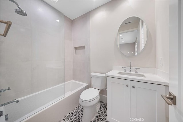 full bathroom with tile patterned floors, vanity, toilet, and tiled shower / bath