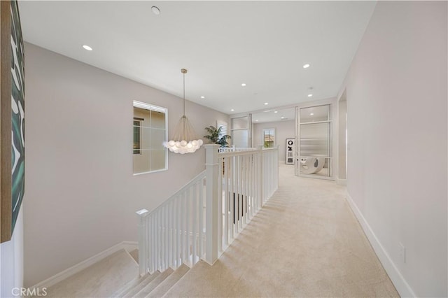 hallway featuring light carpet