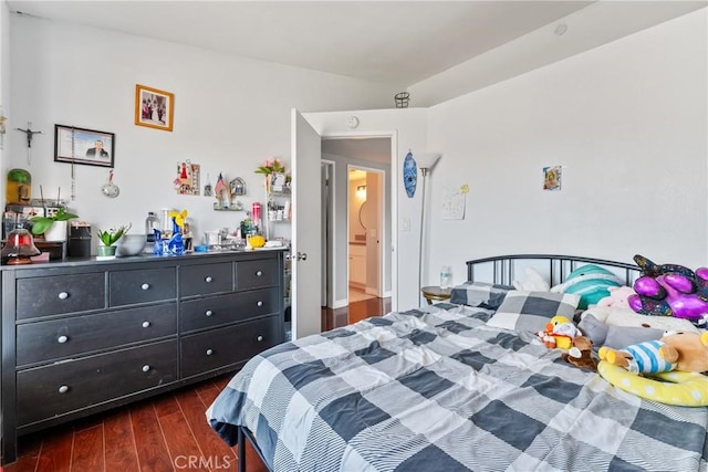 bedroom featuring dark wood-style flooring