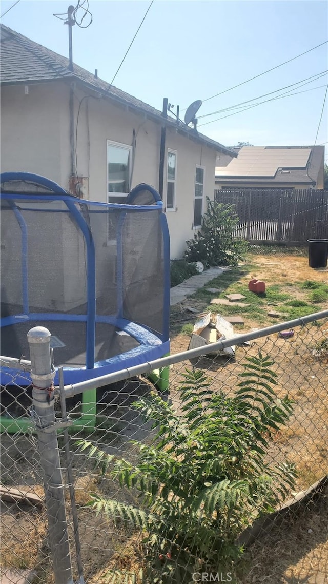 view of yard with a trampoline