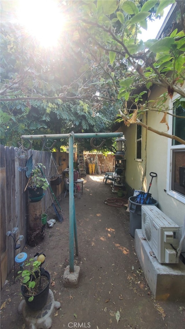 view of yard featuring a patio and ac unit