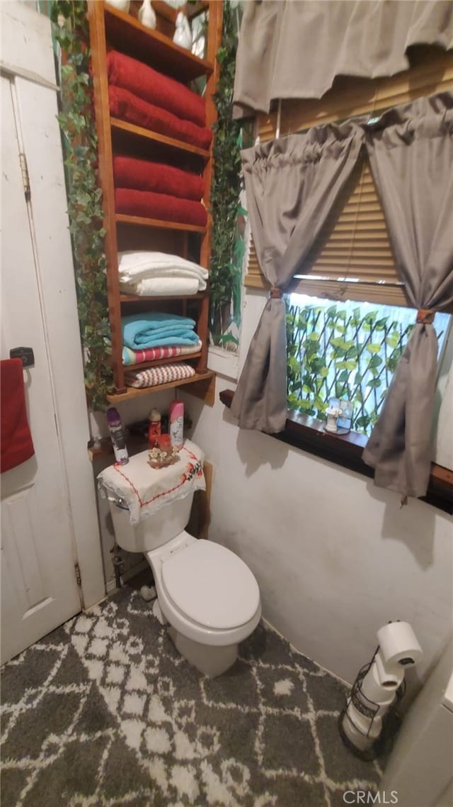 bathroom featuring toilet