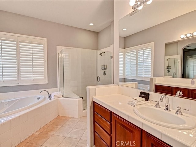 bathroom featuring vanity, separate shower and tub, and tile patterned floors