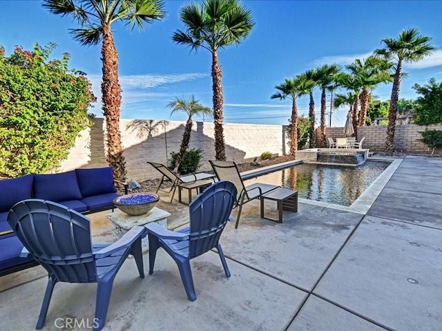 view of patio with a fenced in pool and outdoor lounge area