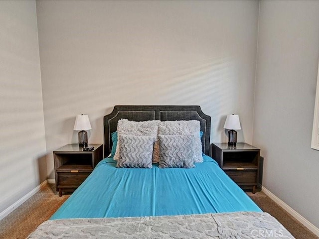 bedroom featuring dark colored carpet