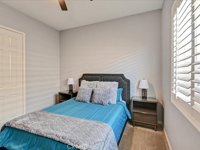 carpeted bedroom with ceiling fan