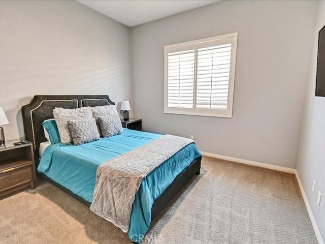 bedroom featuring light colored carpet